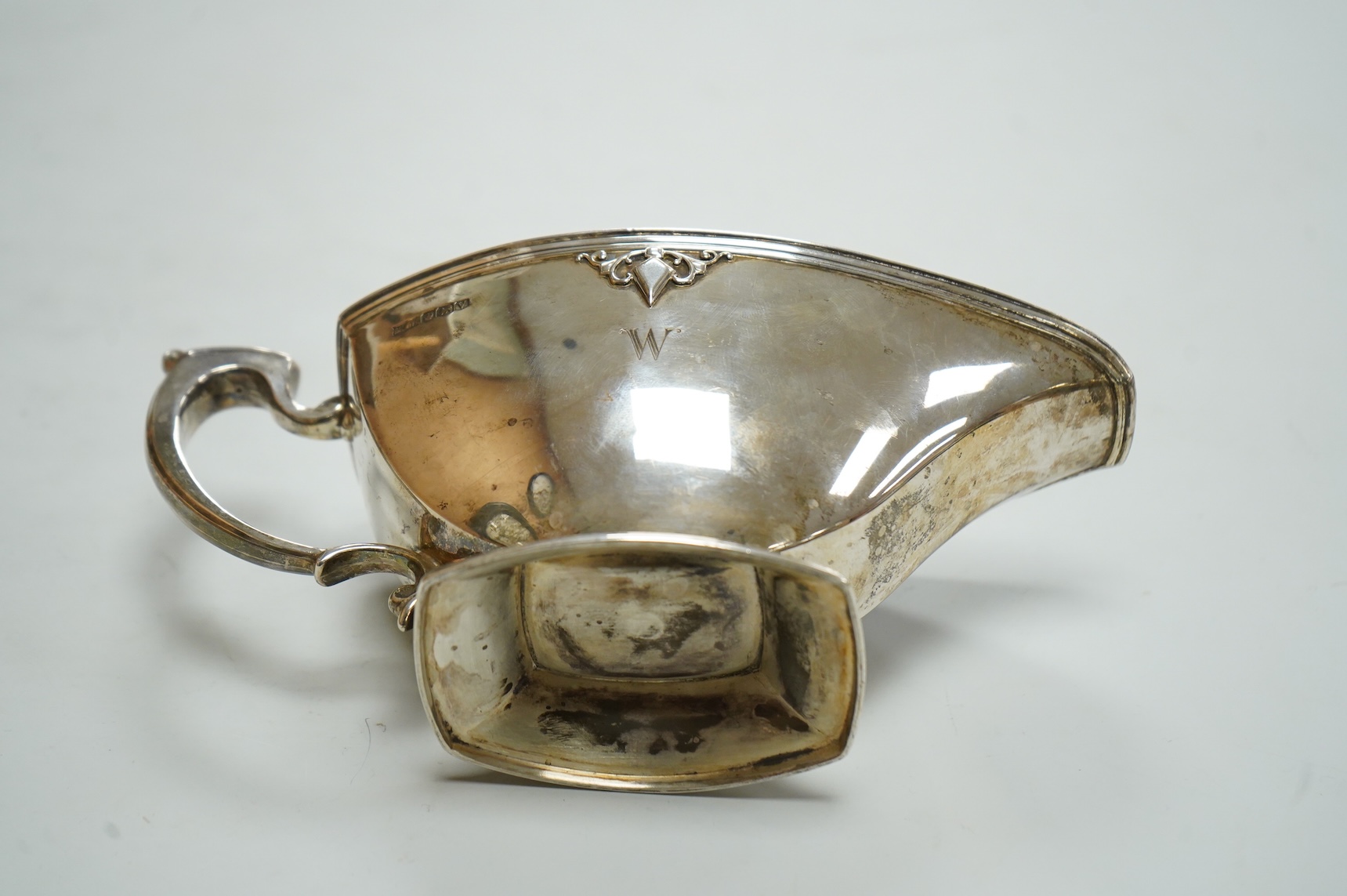 A George VI silver sauceboat by Mappin & Webb, Sheffield, 1938, with engraved initial, length 20cm, 6.9oz.